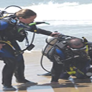 Divermaster rescuing a student at Monterey